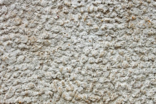 Relief concrete stucco wall covering. Macro shooting