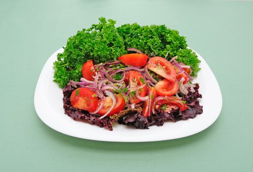Salad of tomato with sharp blue onion and parsley  
