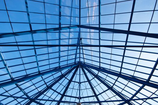 Blue sky through glass roof of modern biulding