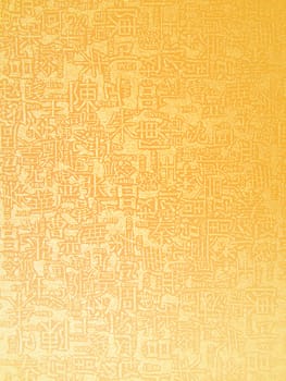 Golden chinese letters on golden background