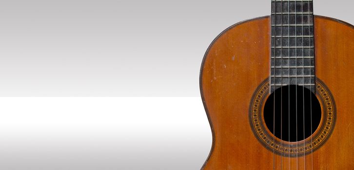Classical guitar with nylon strings on highlight background