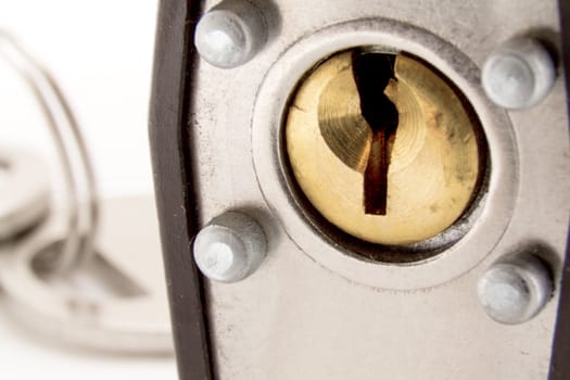 Closeup shot looking at a pin tumbler lock of a padlock