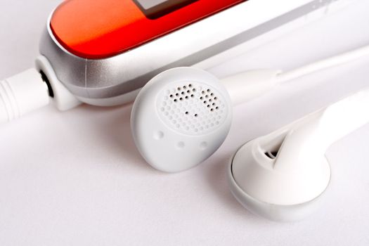 mp3 player with headphoneson on a white background