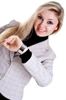 woman looks at the clock on a white background