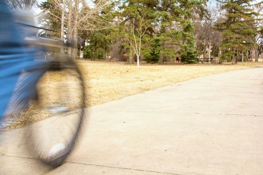 A young boy riding his mountain bike with motion blur