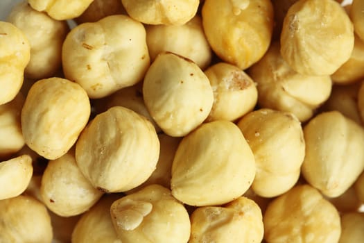 close up of baked peeled hazelnuts