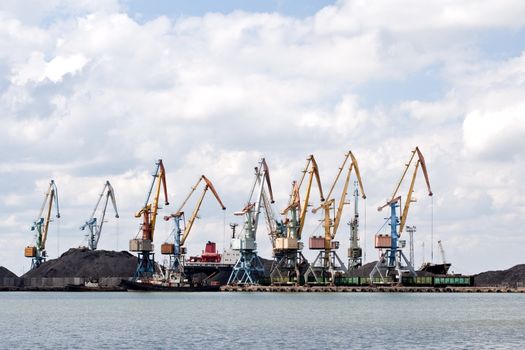 seaport with the tower cranes on the skyline