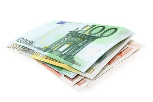 a stack of Euro notes on a white background