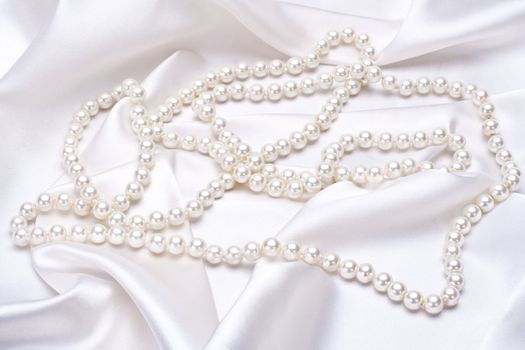 jewels on white satin as a background