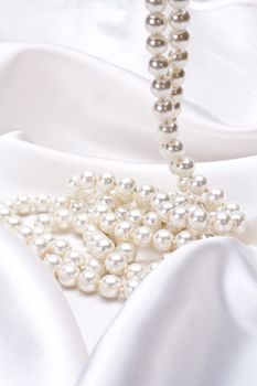 jewels on white satin as a background