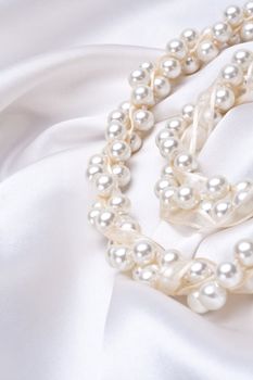 jewels on white satin as a background