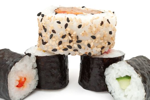 Close up capturing a selection of fresh Maki rolls arranged over white