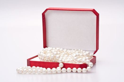 pearls in a red gift box
