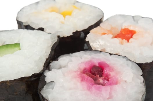 Close up capturing the tops of four fresh Maki Rolls with white background