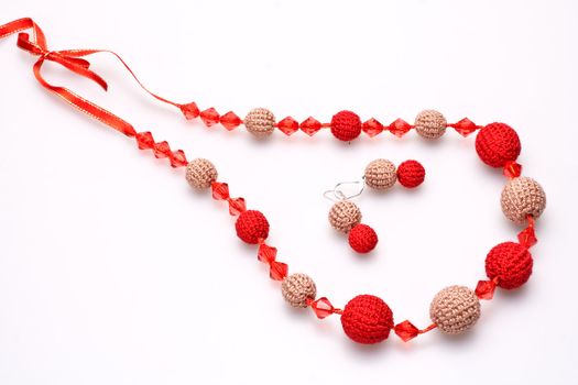 necklace of beads knitted on a white background