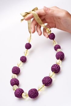 necklace of beads knitted on a white background