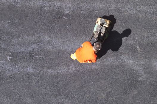 Constraction worker building a new road surface