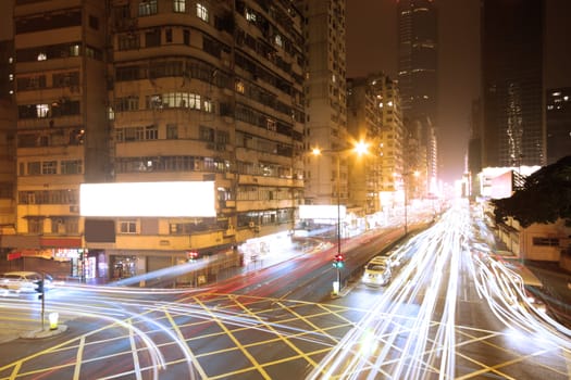 traffic night and modern building in hong kong