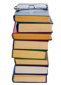 close-up pile of books and glasses, isolated on white