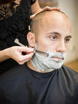 Shaving situation at the hair salon close-up