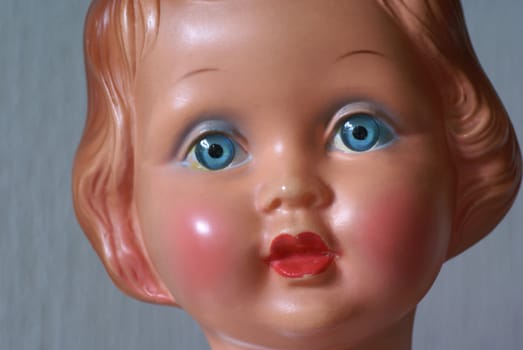 Part of the face of an old doll.             