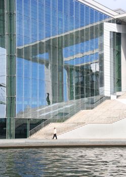 Man walking past a German parliament building in Berlin