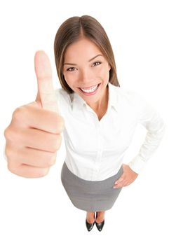 Thumbs up success woman happy smiling. High angle view of young successful mixed race Asian Caucasian businesswoman isolated in full body on white background.