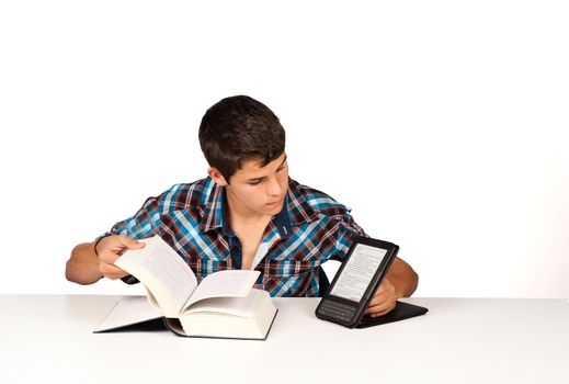 Student comparing a traditional  book with its modern version