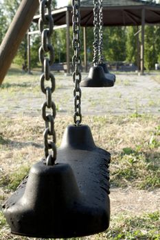 The loneliness and sadness of a childhood denied, represented by a decadent and abandoned playground