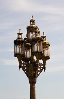 A Gas Street Lamp stands against the warm summer sky