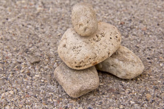 Arrangement of four stones resembling a human form with the head