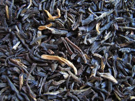 A photograph of loose leaf black tea.
