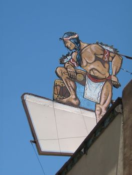 A photograph of an old sign on a building.