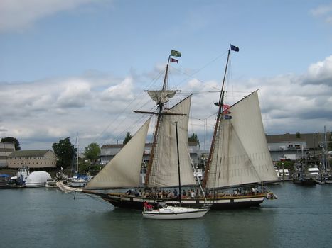 A photograph of a large wooden sail boat.