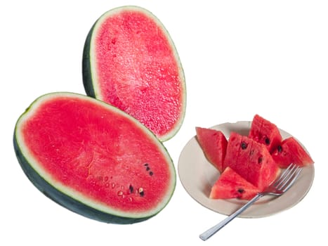 Pieces of fresh watermelon in dish with fork ready to eat