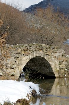 Old medieval bridge at the Spanish countryside