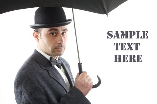 Portrait of a man with bowler hat and an umbrella  over white