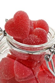 Red heart shaped jelly sweet in a glass jar