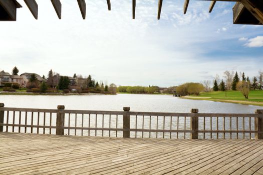 a tranquil scene from the deck overlooking a small body of water