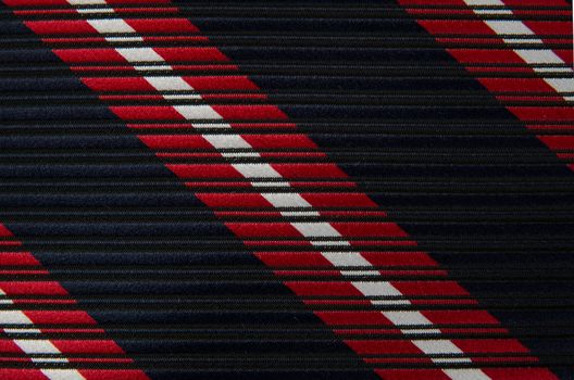 Closeup view of a striped neck tie, could be used as a background.