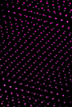 Black plastic mesh texture backlit with pink light.