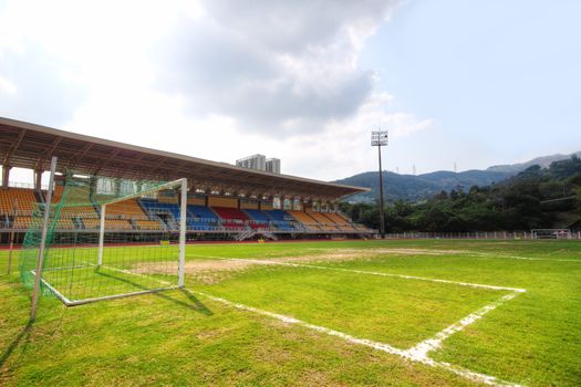 Soccer stadium , green grass and sky
