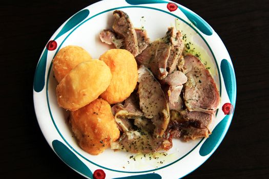 Potato with the cut meat lamb on a plate 