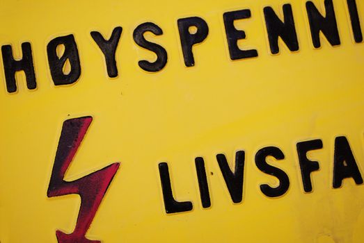 A norwegian high voltage warning sign.