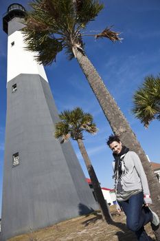 Girl posing by Tybee Island Lighthouse in Georgia