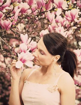 Girl and Magnolia flowers - spring time.