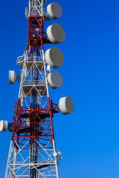Communications tower with a beautiful blue sky