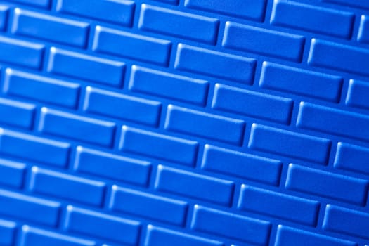 A wall formed by metal bricks