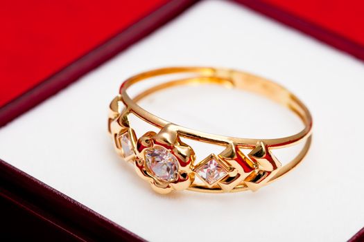 Fantastic gold ring adorned with several white zirconia
