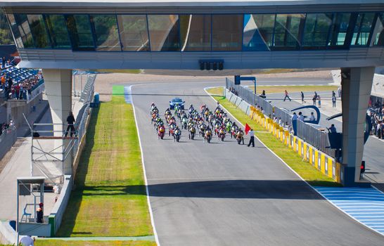 JEREZ DE LA FRONTERA, SPAIN - APR 17: Motorbike competitors begin the Moto2 race in the CEV Championship on April 17, 2011 in Jerez de la Frontera, Spain.